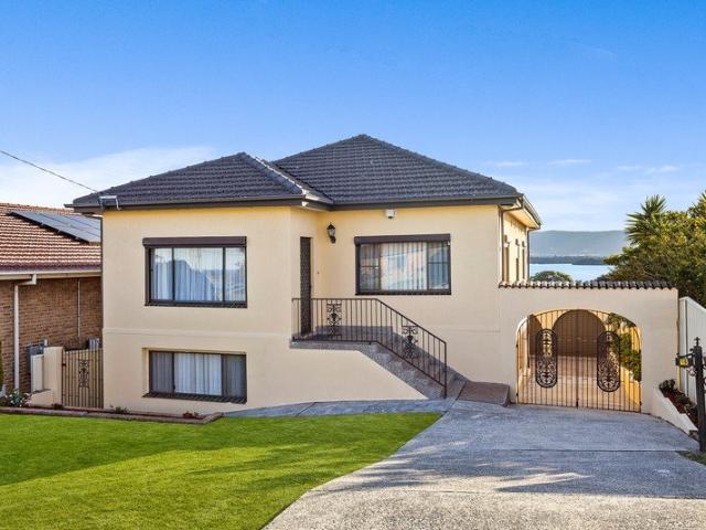 Elevated Lake Views & Versatile Dual Living
