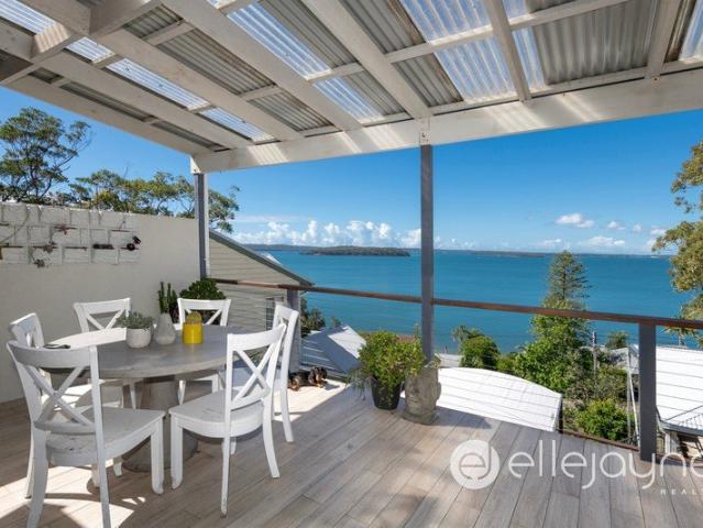 ELEVATED LAKESIDE LIVING WITH BREATHTAKING VIEWS OF LAKE MACQUARIE