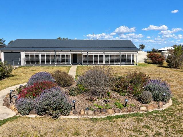 Elevated Lifestyle Living | Beautiful Gardens, Sunset Views & Serious Shed Space