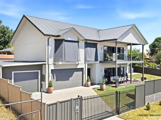 Elevated Modern Home with Stunning Views & Entertainer's Appeal!
