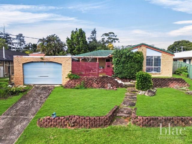 Elevated North Facing Home with Room to Add Value
