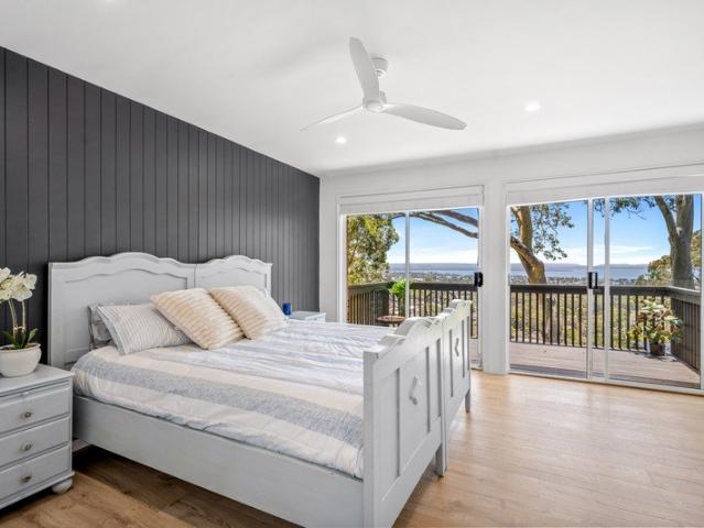 Elevated, north facing living with panoramic views