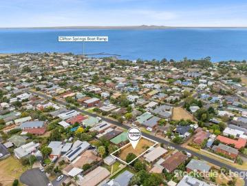 Elevated Opportunity with Bay View Potential