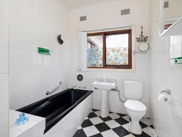 Elevated original home with leafy views and untapped potential