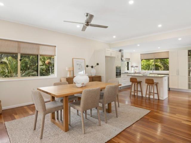 Elevated Queenslander with pool and tranquil bushland backdrop