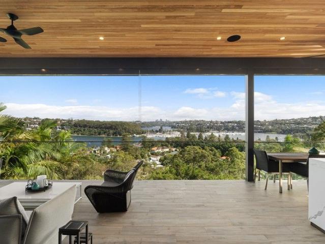 Elevated resort style home with sweeping Middle Harbour views
