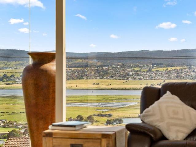 Elevated Riverside Living with Panoramic Views