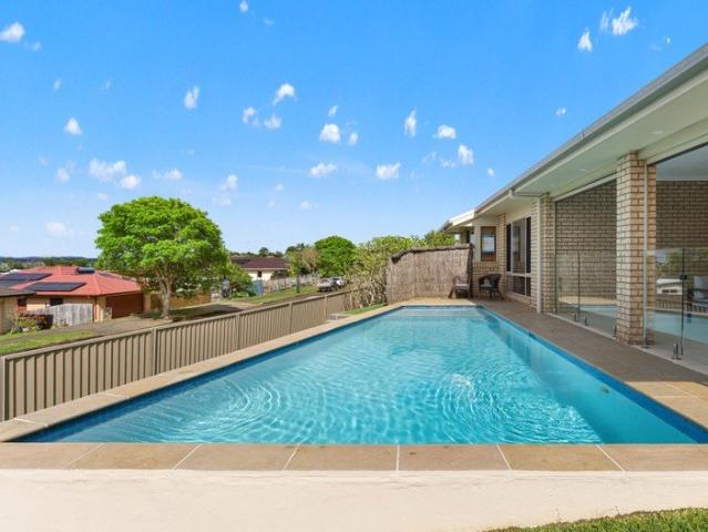 Elevated single level living with ocean views & pool