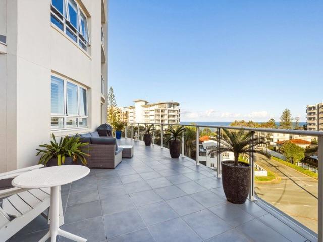 ELEGANT COASTAL LIVING WITH OCEAN VIEWS & A RARE ENTERTAINER'S TERRACE