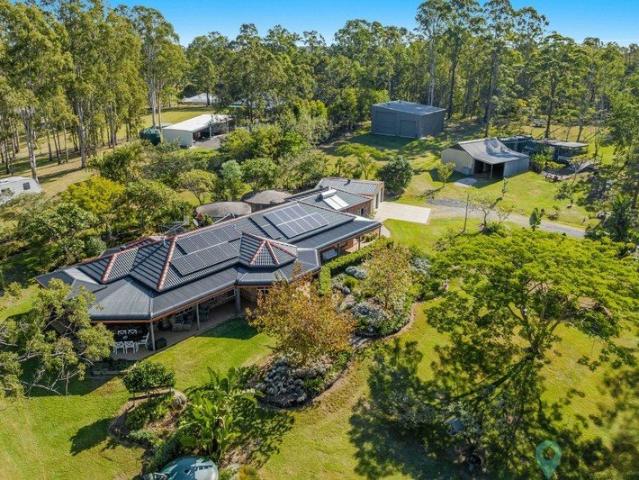 Elegant country home, Extensive shedding on 3 acres of manicured garden surrounds