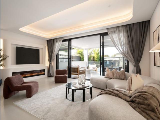 Elegant Duplex with Spacious Living and Inviting Pool