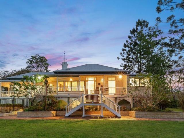 Elegant Farm Style Home with Timeless Character & Acreage