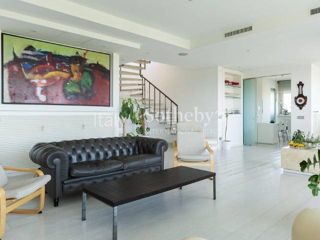 Elegant Penthouse with Panoramic Terraces in Rome's EUR District