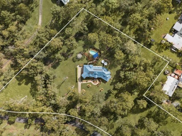 Elegant & Premium Acreage Living with Pool & Sweeping Views