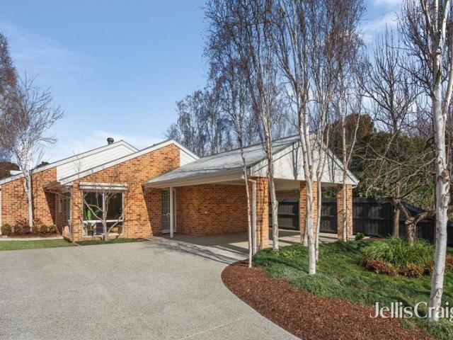 Elegant single level residence just steps from prized schools