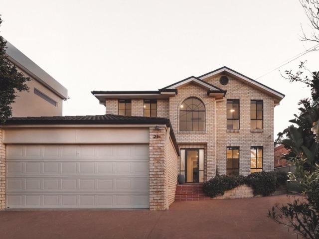 Elegant Two Story Residence with Abundant Natural Light and Modern Kitchen