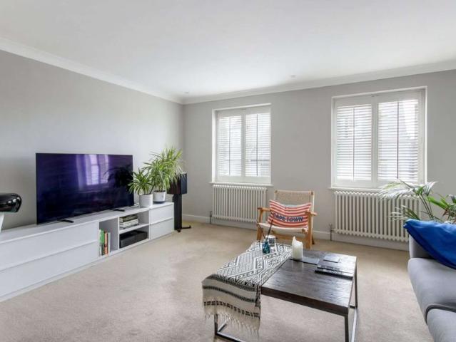 Elegant town centre mews house with premium finishes, south west garden, and parking