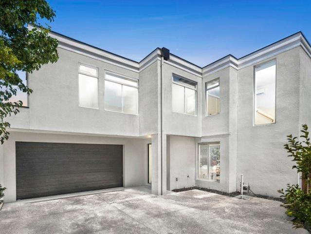 Elegant Townhouse Living in Secluded Riverside Setting