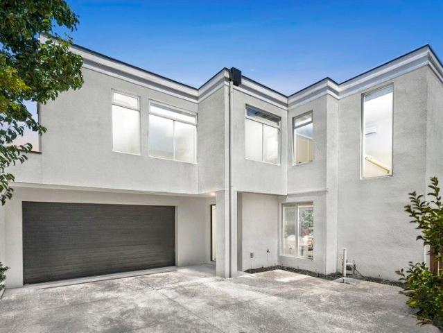 Elegant Townhouse Living in Secluded Riverside Setting