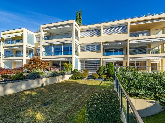 Elegante Wohnung mit Garten und Seeblick, nur wenige Schritte vom TASI