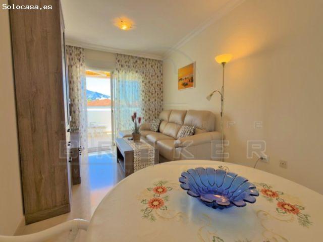 Elegante apartamento con plaza de garaje y piscina climatizada en un complejo