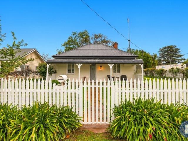 Elegantly Restored Cottage Expansive Land with Opportunity