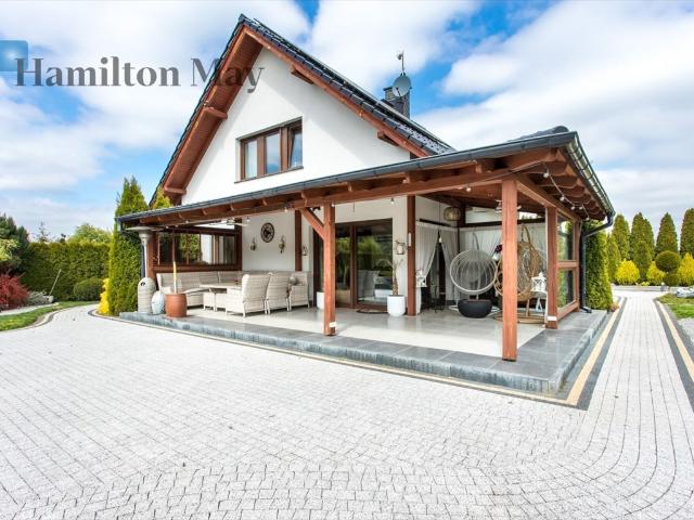 Elegancki dom z ogrodem i fotowoltaiką 119 m²