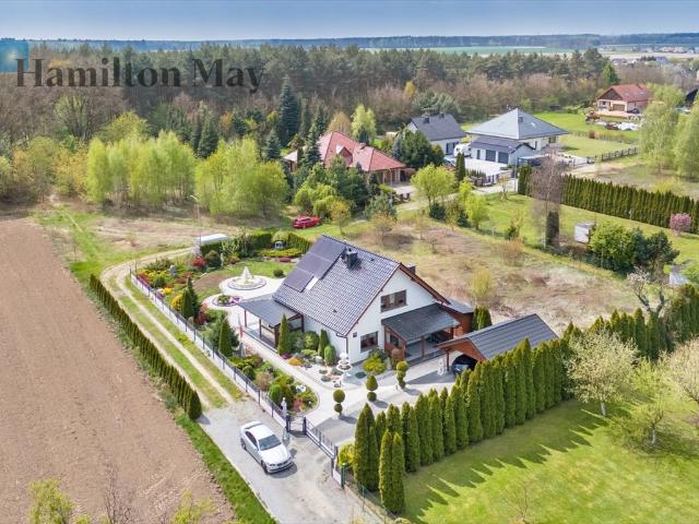 Elegancki dom z ogrodem i fotowoltaiką 119 m²