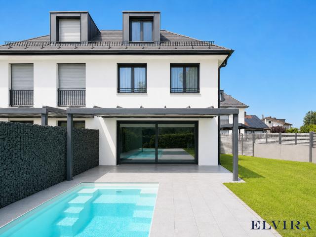 Elvira Altaubing Besondere Doppelhaushälfte mit Pool und großem Garten