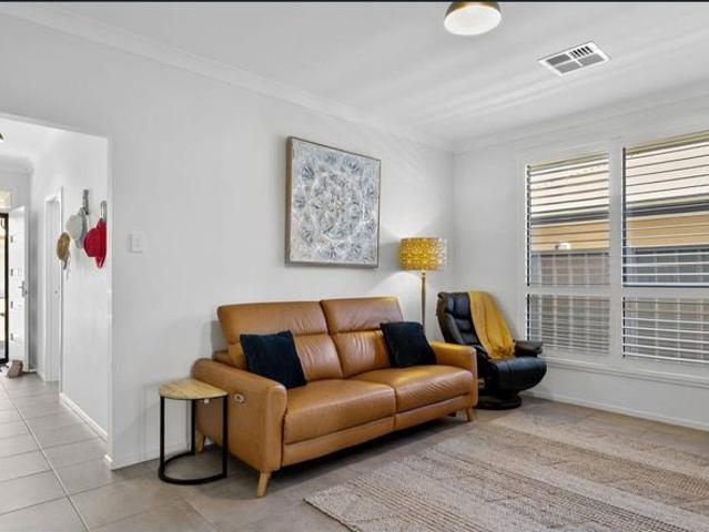Embrace coastal living in this elegant home, offering stunning views and luxury amenities