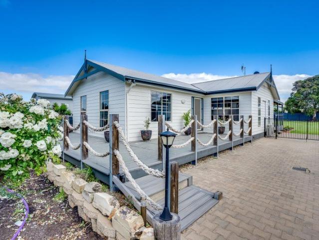 Embrace Relaxed Coastal Living in This Beautifully Maintained Three Bedroom Home