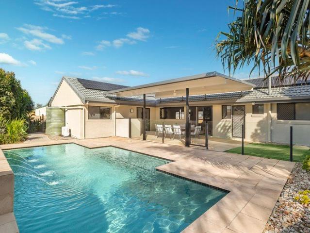 Embrace relaxed poolside living just 6 minutes to the sand