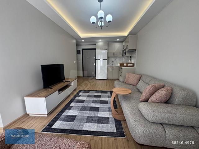 EMLAK STORE'DANYENİ BİNADA SIFIR KONSEPT EŞYALI KİRALK 1+1 DAİRE