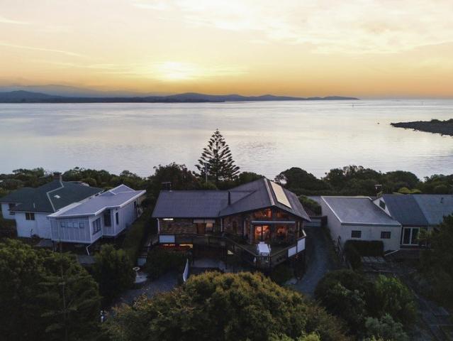 Enchanting Waterfront Living with Private Beach Access