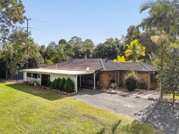 Endless possibilities on usable acreage with dual living & minutes to Samford Village
