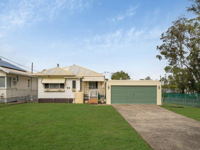 Endless Potential on a Spacious Allotment with Dual Garages & Side Access