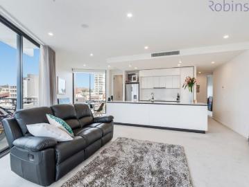 Enjoy the Northern aspect and views in this spacious two bedroom, two bathroom, air conditioned apartment