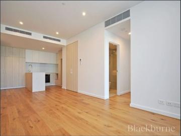 ENJOY CITY VIEWS AND A LARGE ENTERTAINER’S BALCONY