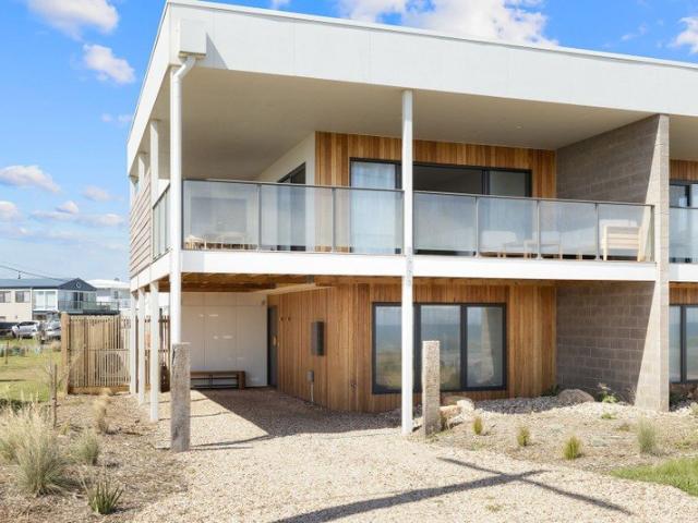 Enjoy relaxed coastal living in this modern, absolute beachfront home located on beautiful Phillip Island