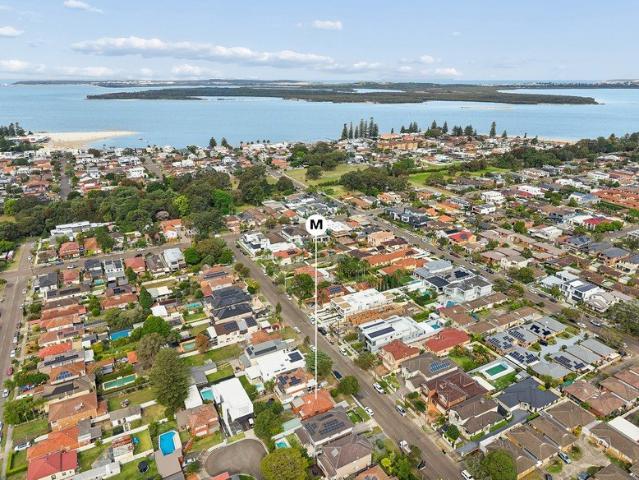 Enticing opportunity within coveted bayside enclave