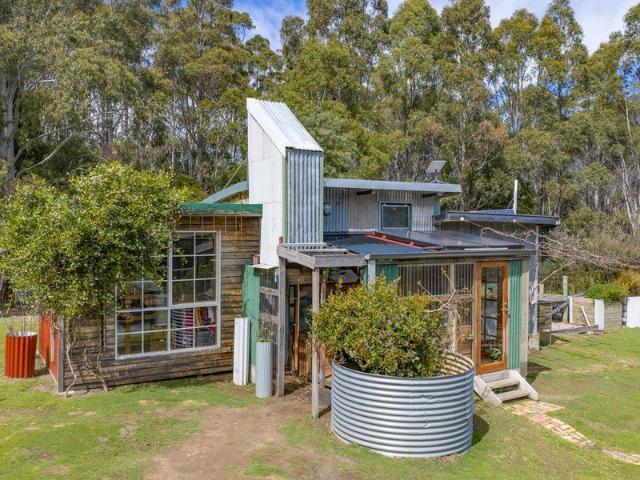 Escape to self sufficiency: 75 acres with cabin, water & views
