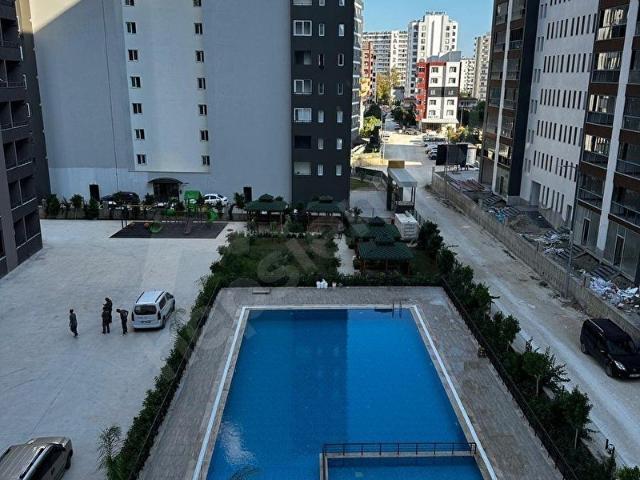 ERDEMLİ ARPAÇBAHŞİŞTE LÜKS SİTE İÇERİSİNDE SATILIK 1+1 DAİRE