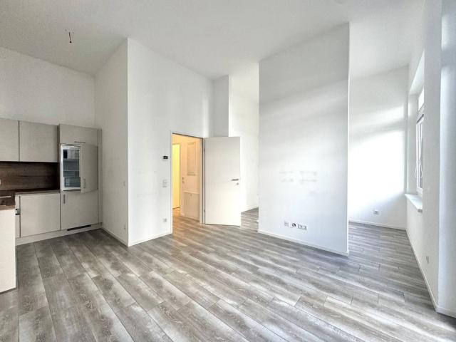 Erdgeschosswohnung mit großzügiger Terrasse und 3,5 Meter hohen Decken nahe Hauptbahnhof inkl. Gemeinschaftspool