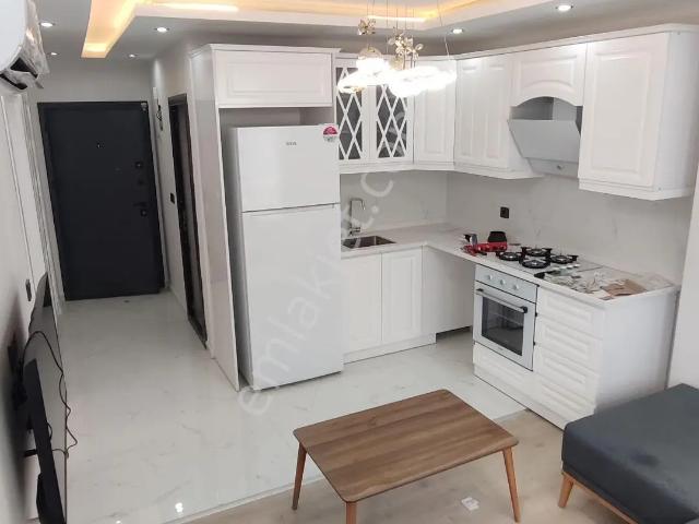 Erguvan Caddesi Üzeri 1+1 Sıfır Eşyalı Az Katlı Kiralik