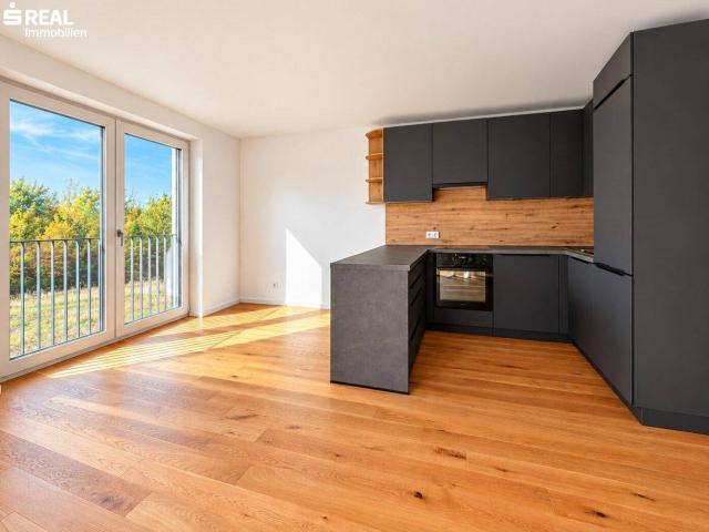 Erstbezug: 2 Zimmer mit Garten, moderner Küche und Carport