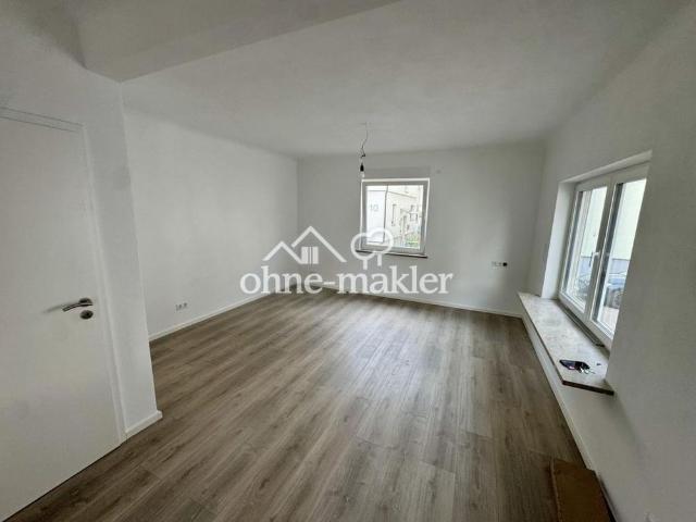 Erstbezug: Exklusive Wohnung mit Garten, Garage & Fußbodenheizung