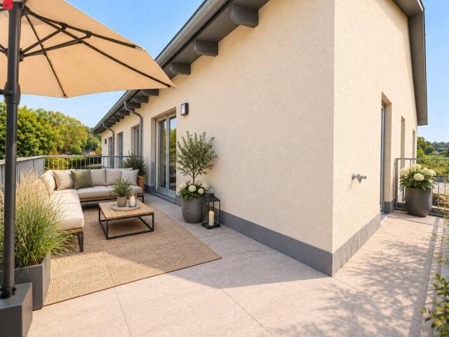 Erstbezug mit Wow Effekt – 20 m² Südwestbalkon & Carport