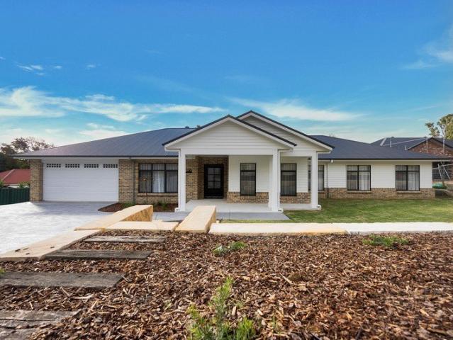 Exceptional Family Living Set on an Expansive Acre