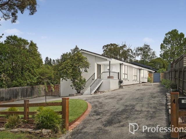 EXCEPTIONAL FAMILY SANCTUARY WITH MODERN STYLE AND EXPANSIVE OUTDOOR SPACE