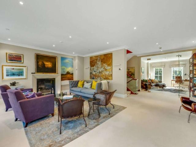 Exceptional five bedroom townhouse situated in one of Esher's premier private roads